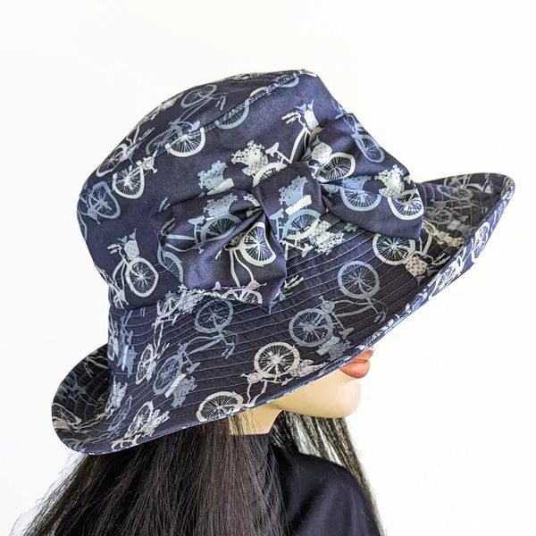 Big Brim Beach Hat, with bow and pretty bike inspired print in blues