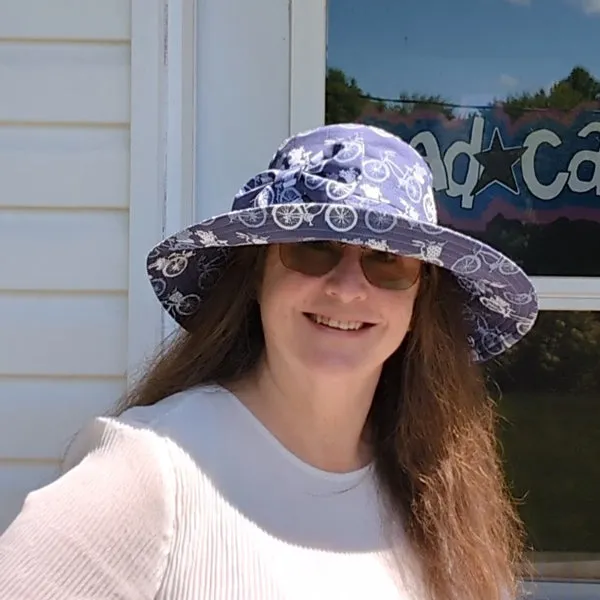 Big Brim Beach Hat, with bow and pretty bike inspired print in blues
